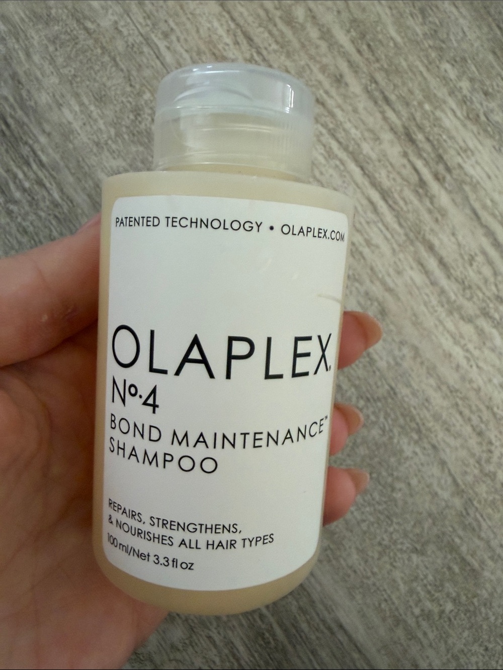 OLAPLEX No.4 Bond Maintenance Shampoo - Cream and White Bottle
